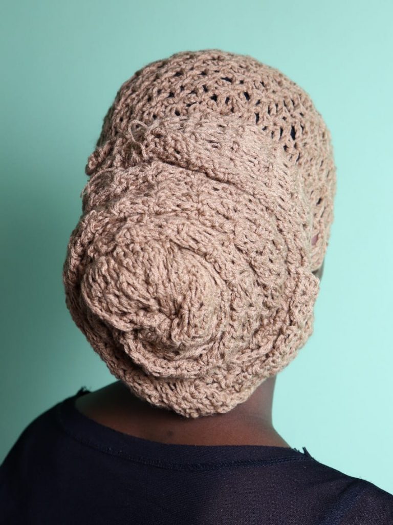 an image showing how to tie a crochet headwrap